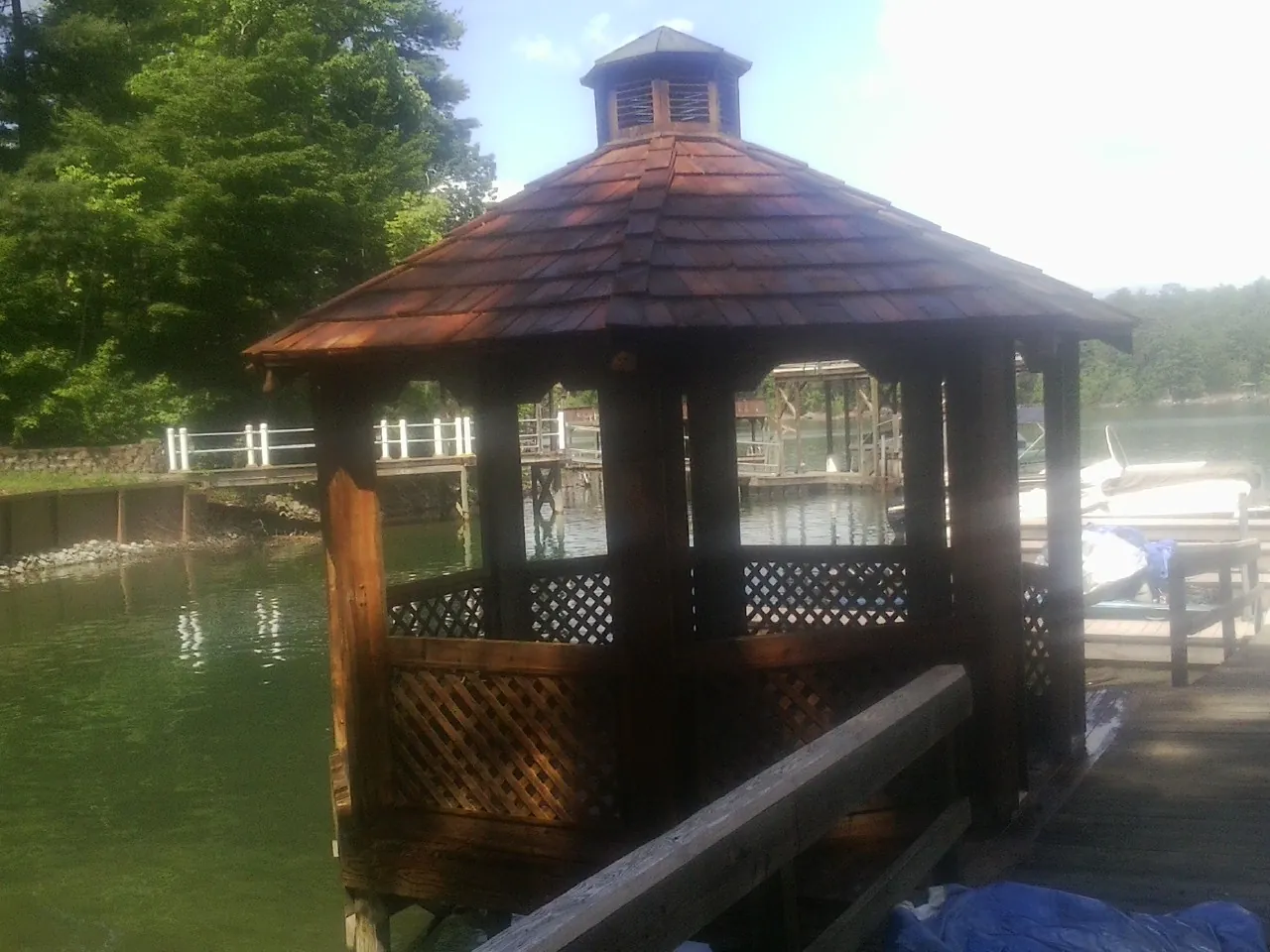 Cedar shake gazebo roof rebuilt on a lake dock in Woodbury